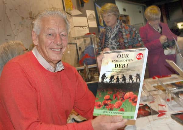 Derek Simmonds shows off his new book, Our Unforgotten Debt', which recognises the deeds and sacrifices of the Melton Mowbray and District Territorials 1914-1918 EMN-161116-154405001