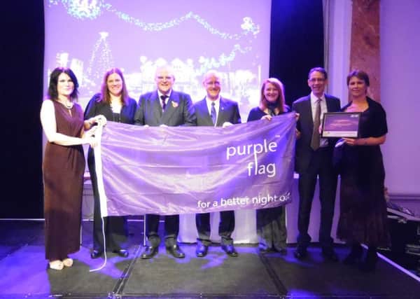 Melton Council members and officials celebrate the authority's Purple Flag award EMN-161115-143753001