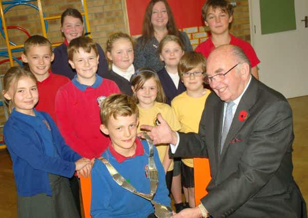 Fraser Morley is made Mayor for the day by real Mayor David Wright and the school council PHOTO: Tim Williams