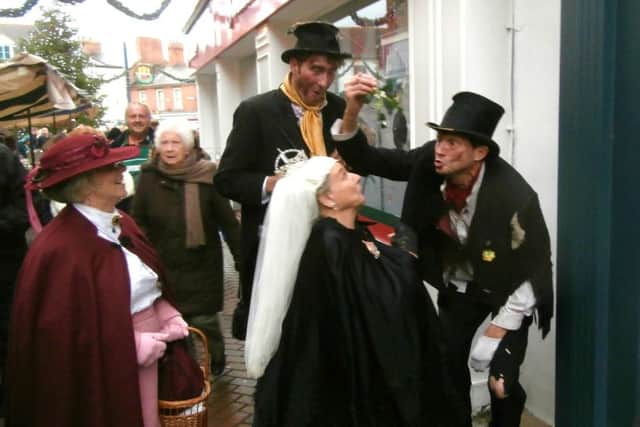 Mischievous 'urchins' at the Melton Victorian Christmas Fayre, puckering up to Queen Victoria PHOTO: Roy Fisher