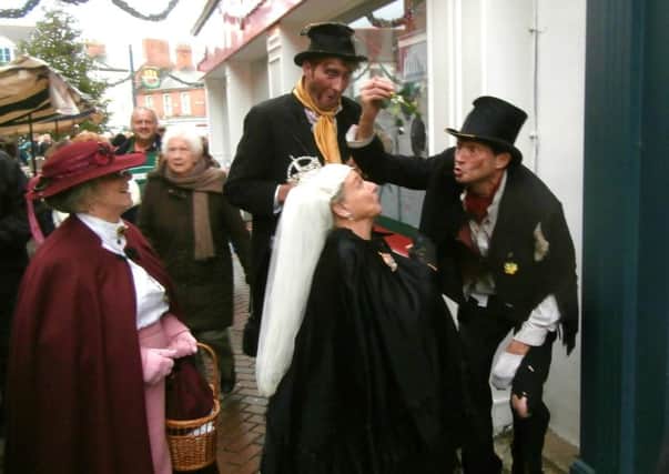 Mischievous 'urchins' at the Melton Victorian Christmas Fayre, puckering up to Queen Victoria PHOTO: Roy Fisher