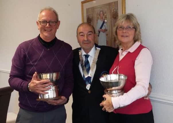 Ian Solloway (left) and Denise Waldron claimed county silverware for Melton Golf Club EMN-161115-171848002