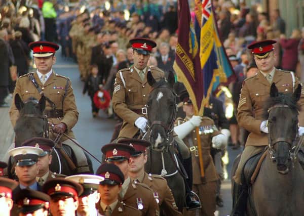 Mounted officers from the Defence Animal Centre, Melton, taking part in Sunday's Remembrance Day parade through the town EMN-161114-103414001