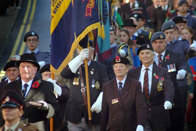 Members of the Melton branch of the Royal British Legion and the town's RAFA club members march to the wreath-laying ceremony on Remembrance Day EMN-161114-103424001