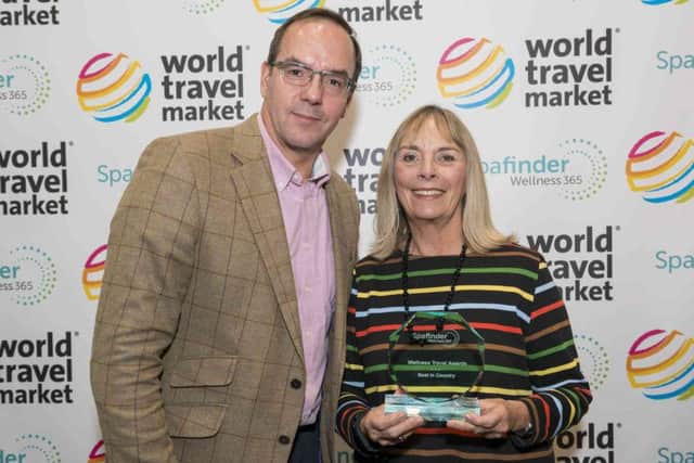 Spafinder Wellness chief operating officer John Bevan presents the award for UKs Best Spa to Ragdale Hall co-owner Penny Nesbitt EMN-161114-151413001
