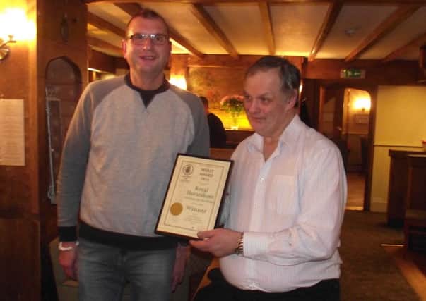 Melton CAMRA chaiman Kevin Billson presents a Merit Award to landlord Mick Nicklinson for the quality of his cask ales at the Royal Horseshoes, at Waltham EMN-161114-162040001