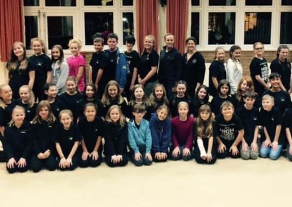 Students from the Performing Stars Academy pose with some of the West End stars PHOTO: Supplied