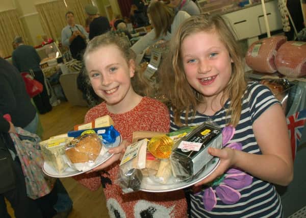 Emily Collins and Imogen Kingston found some local tasty treats from Melton Cheeseboard and the Fairtrading Post PHOTO: Tim Williams