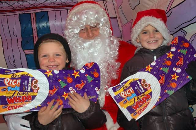 Five-year-old Jack Kennedy and brother Kye (7) meet Santa in his grotto PHOTO: Tim Williams