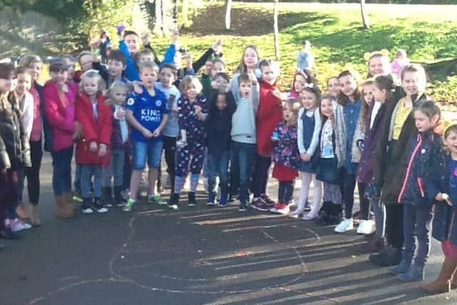 Frisby Primary School had lots of fun last Friday. In return for a donation all children wore non-uniform and made a two metre long, coin filled Pudsey on the playground. Class four children also decorated and sold biscuits in the shape of planets. A total of Â£190 was raised for Children in Need PHOTO: Supplied