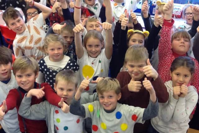 Great Dalby Primary School children wore something spotty, sold cakes and ran a guess the number of spots in the jar competition. They raised approximately Â£260 PHOTO: Supplied