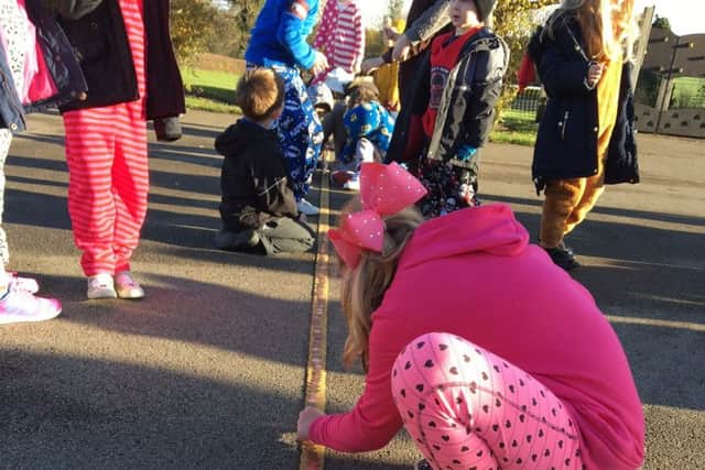 Old Dalby Primary Scool pupils raised Â£256.78 by wearing pyjamas to school, making penny trails and penny Pudseys, and by selling cakes and books at lunch time PHOTO: Supplied
