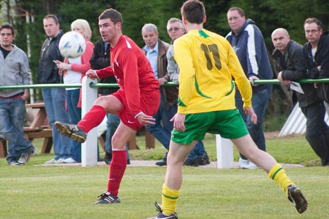 Action from the 2009/10 Melton Charity Cup final when Melton Mowbray beat Holwell on a penalty shoot-out PHOTO: Jim Harrison