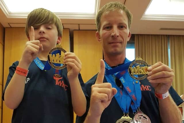 Morgan Penniston with dad and fellow world champion Brent EMN-161123-165402002