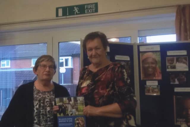 Janet Key presents a certificate to Linda Peters for the centre's wonderwall PHOTO: Supplied