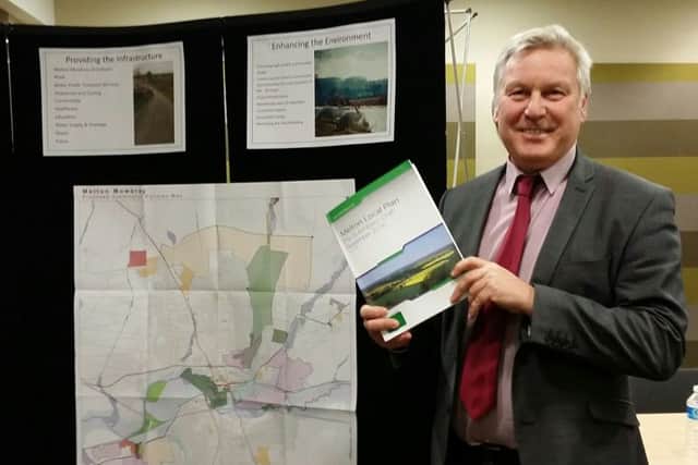 Jim Worley, Melton Council's head of regulatory services, hold a copy of Melton's draft Local Plan document at Tuesday evening's final public consultation event EMN-161130-132009001