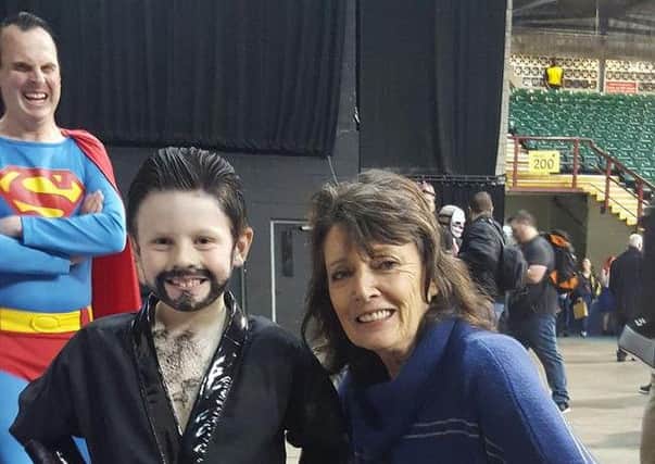 Sam Pick in his award-winning Superman costume meets Sarah Douglas, an actor from the early movies about the superhero EMN-161129-112814001