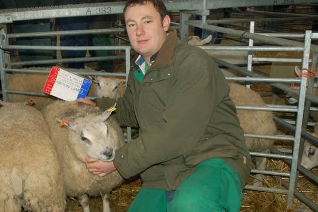 Robert West shows off his Champion Lambs at the Melton Fatstock Show EMN-161130-152404001