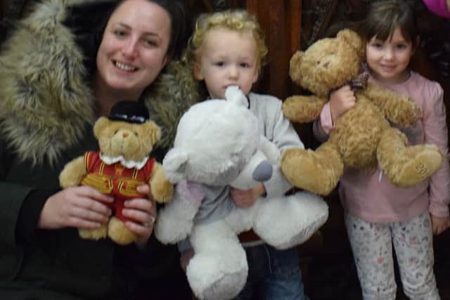 Annaleise, Jenson and Ellie, of the St Mary's Church Tiny Tots Group, with some of the bears that have already been donated PHOTO: Supplied