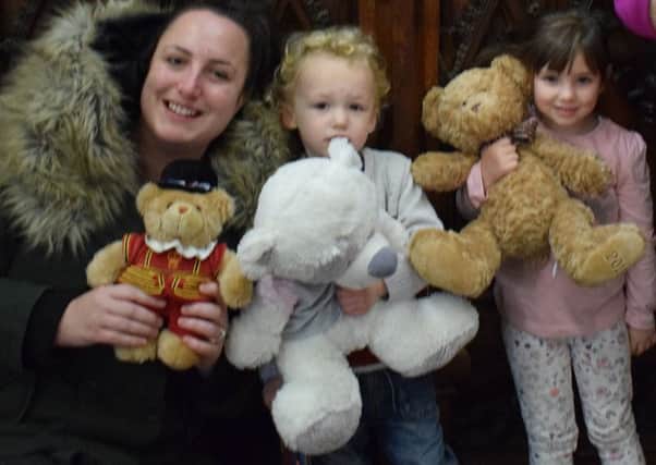 Annaleise, Jenson and Ellie, of the St Mary's Church Tiny Tots Group, with some of the bears that have already been donated PHOTO: Supplied