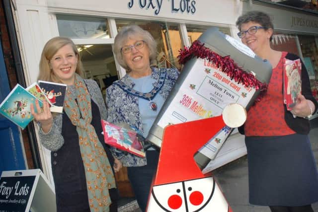 Foxy Lots : Owner Kim Baker with daughter Bethany and former Cards for Good Causes organiser Dinah Hickling. EMN-161128-125946001