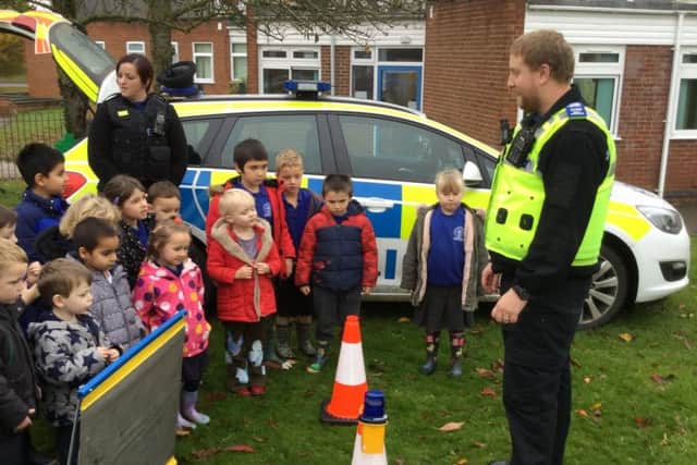 Melton police officers PCSO Matthew Robinson and PCSO Donna Varley speak to pupils at St Peter's Primary School PHOTO: Supplied