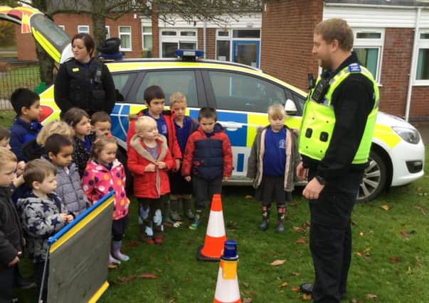 Melton police officers PCSO Matthew Robinson and PCSO Donna Varley speak to pupils at St Peter's Primary School PHOTO: Supplied