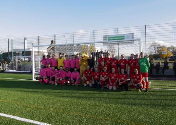 Pudsey poses with staff and students who played football against each other for Children in Need. The students were victorious 6 goals to 3 
PHOTO: Supplied
