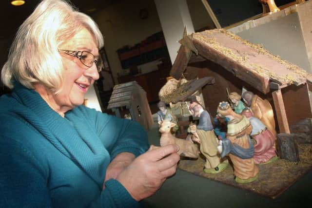 Dawn Newton puts the finishing touches to her pottery nativity scene PHOTO: Tim Williams