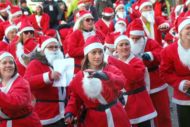 The Santas warm-up before the start PHOTO: Tim Williams