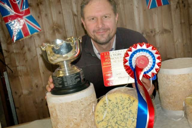 Tuxford and Tebbutt Process Manager Peter Hughes with their cup for Best Stilton cheese in Show.