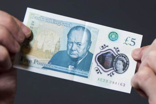 Brits are being urged to check their new fivers after engraved bank notes worth as much as £50,000 were circulated in a Willie Wonka-style 'Golden Ticket' giveaway.