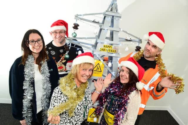WPD Grantham Depot : Decorating their Pylon Christmas Tree : L-R Louise Chartlon, Mark Baxter, Rosie Richardson, Kelly Emmerson and Colin Merritt : Photo: Lionel Heap