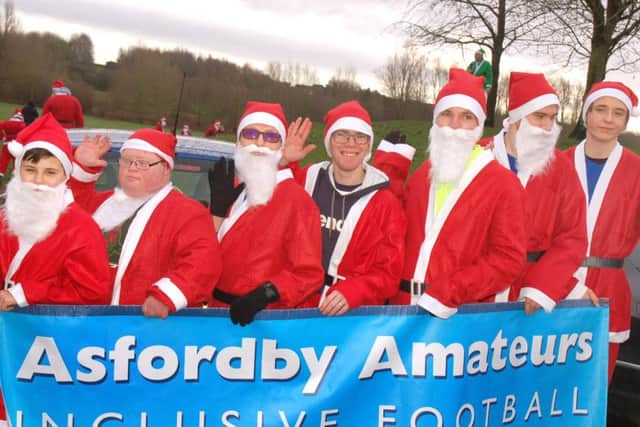 The Asfordby Amateurs inclusive footballers line up in their Santa suits PHOTO: Tim Williams