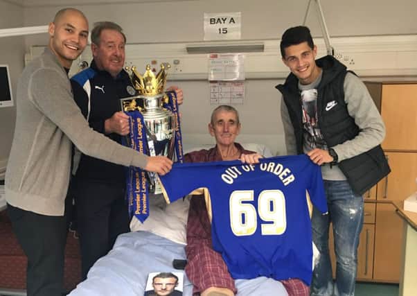 LOROS patient Brian Kettell, from Melton, with Leicester City FC players Yohan Benalouane and Bartosz Kapustka and club ambassador Alan Birchenall and the Premier League trophy EMN-161220-131202001