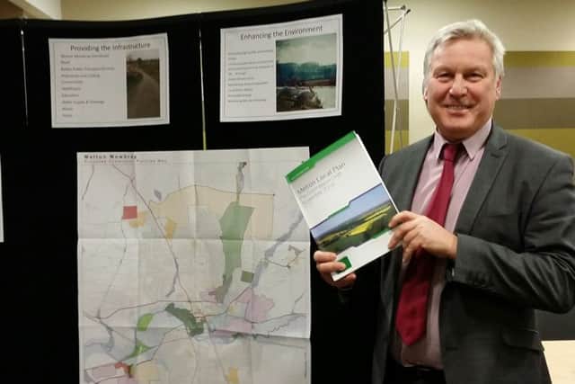 Jim Worley, Melton Council's head of regulatory services, hold a copy of Melton's draft Local Plan document at Tuesday evening's final public consultation event EMN-161214-171226001