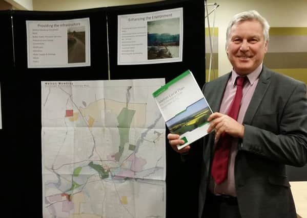 Jim Worley, Melton Council's head of regulatory services, hold a copy of Melton's draft Local Plan document at Tuesday evening's final public consultation event EMN-161214-171226001