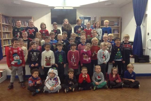 Children show off their Christmas jumpers PHOTO: Supplied