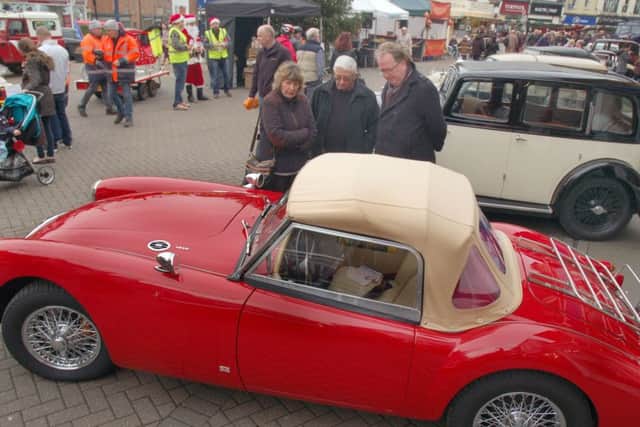 One of the polished classic cars attracts attention in the Market Place PHOTO: Tim Williams