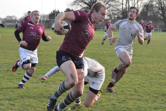 The Over 25s make a break for the line, but the yougner side won the day, 49-39. Picture: Jonathan McGrady/JM News EMN-170301-111421002
