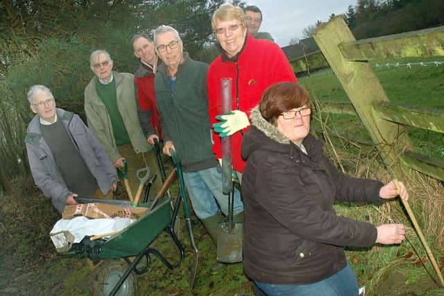Liz Chivers from McDonald's plants the last sapling with the Friends of Melton County Park working group PHOTO: Tim Williams