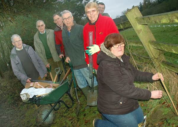 Liz Chivers from McDonald's plants the last sapling with the Friends of Melton County Park working group PHOTO: Tim Williams