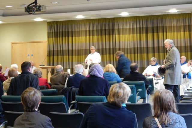 Rev Kevin Ashby takes the first Sunday service in the Melton Council offices after the temporary closure of St Mary's Church to allow a major renovation project to take place EMN-170901-122324001