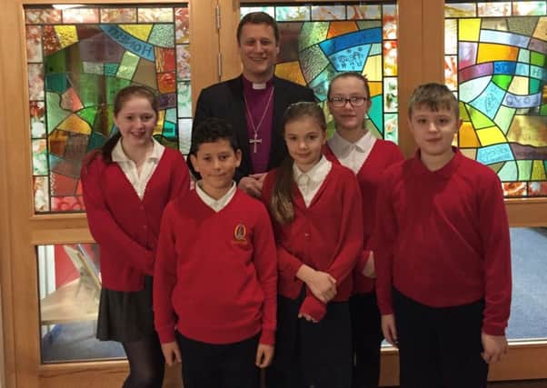 Bishop Martyn Snow with Queniborough School pupils PHOTO: Supplied