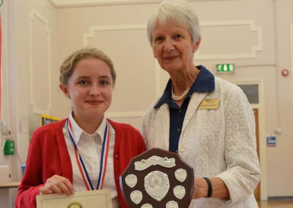 Brownlow Primary School pupil Izabella Roberts (10), receives her junior award last year from Maggie Saunders, from the Rotary Club of Melton Belvoir PHOTO: Supplied