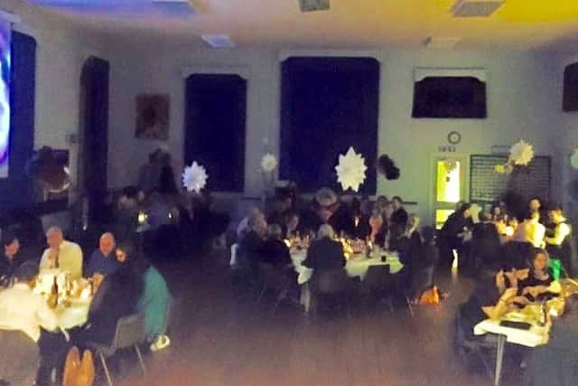 Guests dine together at the St Francis Catholic Primary School bangers and mash ball PHOTO: Supplied