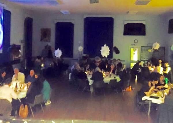 Guests dine together at the St Francis Catholic Primary School bangers and mash ball PHOTO: Supplied