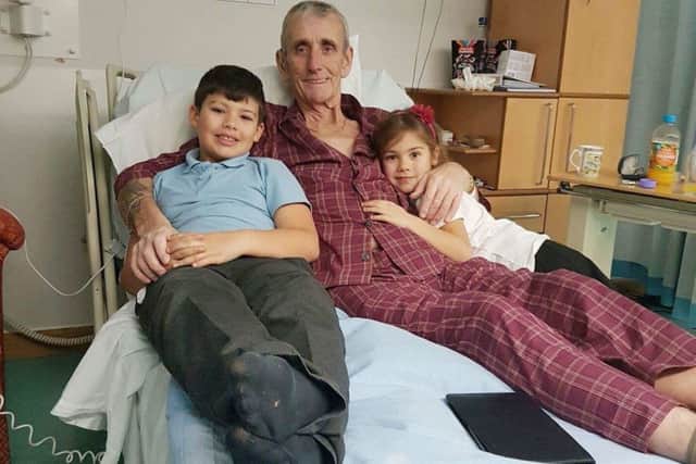 Brian Kettell, who is terminally ill with cancer, at the LOROS hospice with grandchildren Finlay (9) and Jinny (5) EMN-170124-125801001
