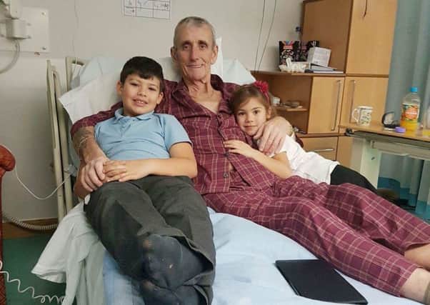 Brian Kettell, who is terminally ill with cancer, at the LOROS hospice with grandchildren Finlay (9) and Jinny (5) EMN-170124-125801001