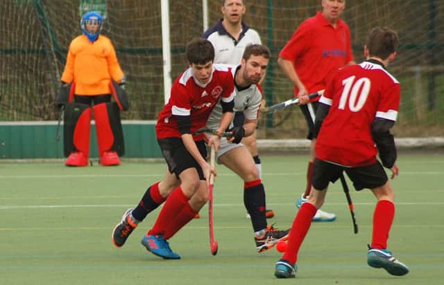 Adam Wells in the thick of things for Melton Hockey Club's Fourth XI on Saturday EMN-170131-121157002